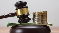 iStock-2189740835.jpg Gavel with Euro Banknotes and Coins – Symbols of Financial and Legal Matters
