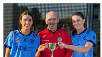 Padraic Treacy chariman cork Camogie board presents the Junior A League cup to Sarah Harter and Grace Tobin from Barryroe.jpeg Barryroe land Junior A camogie league title with strong showing against Bride Rovers