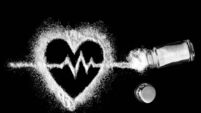 iStock-1366587892.jpg Heart, cardiogram, salt and salt shaker on black background