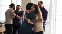 iStock-929376862.jpg Friends hugging each other