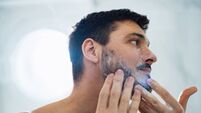 emc men skin care iStock-1390155878.jpg Handsome Man Washing his Face in the Bathroom