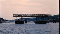 DF6 barges lifting off the spans with new bridge in background.jpg Throwback Thursday: 'Our father was in charge of dismantling the old Youghal bridge'