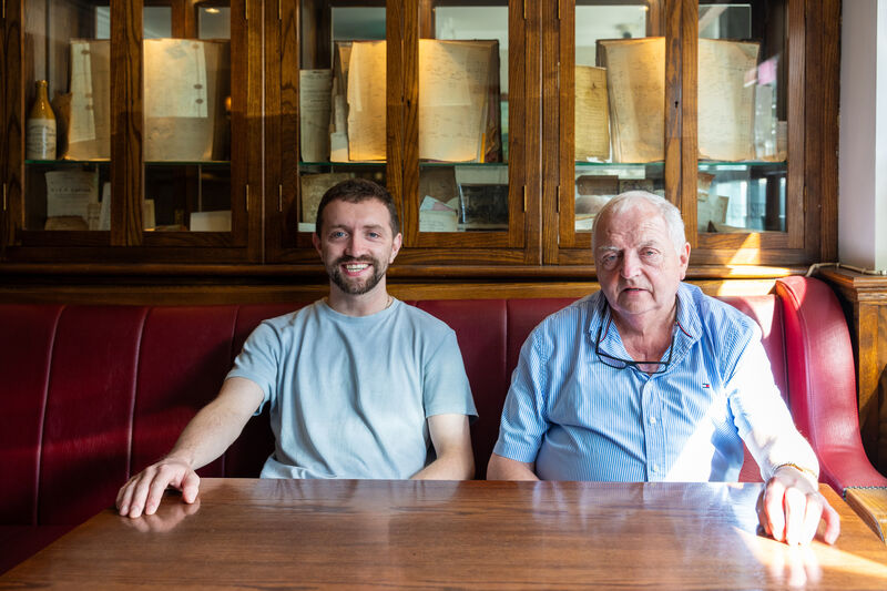 John Cotter and his father Jack Cotter at one of the tables in their bar, TP Cotter’s in Macroom. John Cotter and his father Jack Cotter at one of the tables in their bar, TP Cotter’s in Macroom.