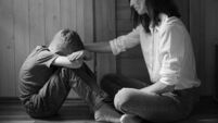 iStock-2175757947.jpg Parent comforting helping sad emotional child at home, concept of bullying, stress disappointment, sadness.