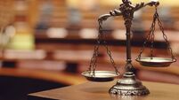 scales-sit-on-a-wooden-table-with-a-blurry-background.jpg Cork man who concealed crack cocaine in his mouth fined €300
