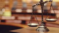 scales-sit-on-a-wooden-table-with-a-blurry-background.jpg Cork man charged with shop robbery allegedly told woman he would stab her in the neck