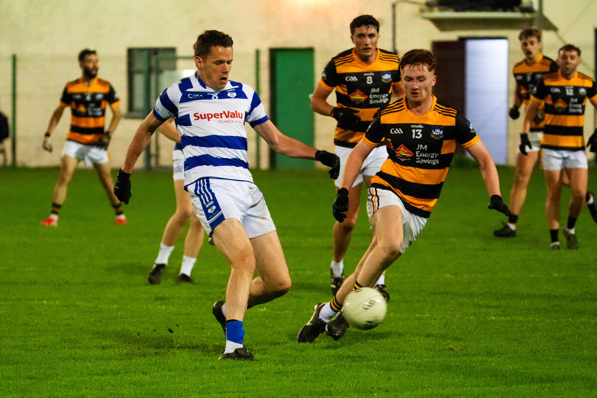 Inniscarra’s David Coughlan passes from Jason Riordan of Canovee. Picture: Noel Sweeney Inniscarra’s David Coughlan passes from Jason Riordan of Canovee. Picture: Noel Sweeney
