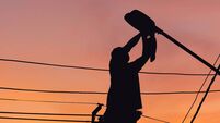 Street lights.jpg Silhouette of Electrician checking lighting to the LED street lamp post, Technician with clipping path and maintenance service c