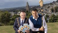 Cork - pictured are the first recipients of the special Cork City Coat of Arms stamp□ Lord Mayor of Cork, Damian Boylan, and gen Cork hurling legend Seán Óg gives his stamp of approval