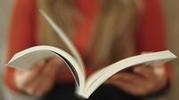 iStock-2149224136.jpg Reading and open book page.