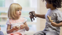 iStock_000084521343_Large.jpg Sharing Toys