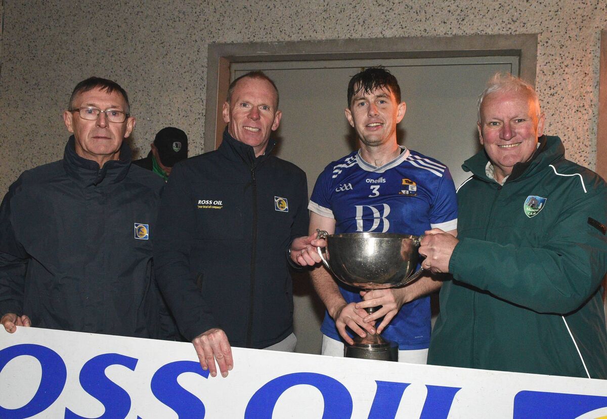 Aghinagh captain Donagh O'Riordan accepts the Muskerry Junior A Football Championship Cup from Ed Warren, Chairman, Muskerry Junior GAA Board in the company of Concubhar Murray and Tim Holland, Ross Oil. Picture: John Tarrant Aghinagh captain Donagh O'Riordan accepts the Muskerry Junior A Football Championship Cup from Ed Warren, Chairman, Muskerry Junior GAA Board in the company of Concubhar Murray and Tim Holland, Ross Oil. Picture: John Tarrant