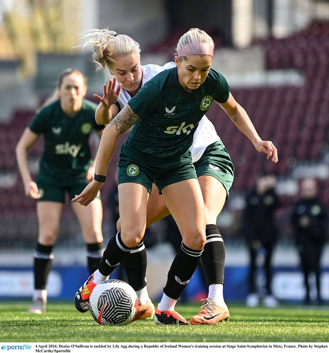 Denise O'Sullivan is tackled by Lily Agg during a Republic of Ireland Women's training session at Stage Saint-Symphorien in Metz, France. Photo by Stephen McCarthy/Sportsfile Denise O'Sullivan is tackled by Lily Agg during a Republic of Ireland Women's training session at Stage Saint-Symphorien in Metz, France. Photo by Stephen McCarthy/Sportsfile