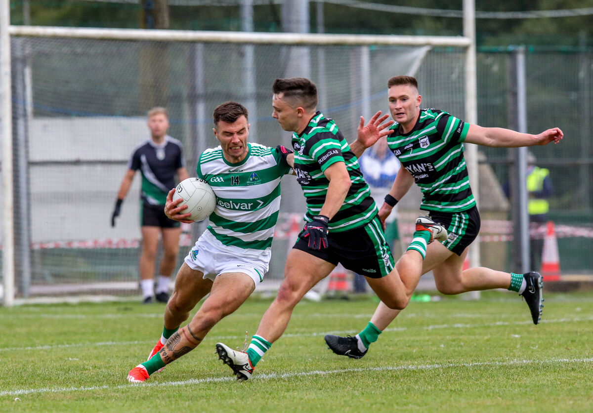 Valley Rovers' Fiachra Lynch under pressure from Douglas' Sean Powter. Picture: David Creedon Valley Rovers' Fiachra Lynch under pressure from Douglas' Sean Powter. Picture: David Creedon