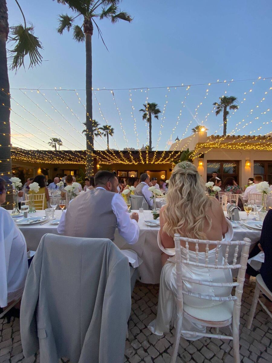 The couple at their wedding reception. The couple at their wedding reception.