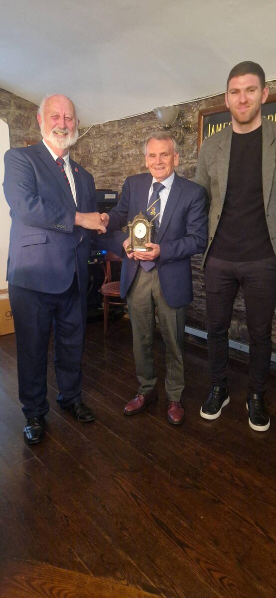 Sean O'Sullivan, presents Carrigaline United's Willie Walsh with a Services to Football award. Also included is Luke Connolly, Heineken Ireland. Sean O'Sullivan, presents Carrigaline United's Willie Walsh with a Services to Football award. Also included is Luke Connolly, Heineken Ireland.