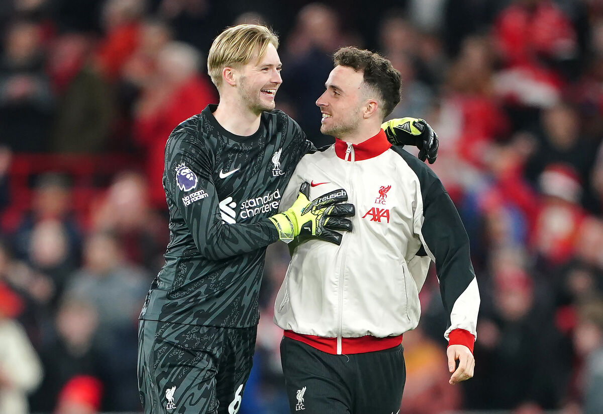 Liverpool goalkeeper Caoimhin Kelleher celebrates with Liverpool's Diogo Jota following the Premier League match against Everton at Anfield, Liverpool. Picture: Peter Byrne/PA Wire Liverpool goalkeeper Caoimhin Kelleher celebrates with Liverpool's Diogo Jota following the Premier League match against Everton at Anfield, Liverpool. Picture: Peter Byrne/PA Wire