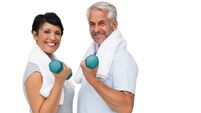 iStock-692901504.jpg Fit mature couple exercising with dumbbells