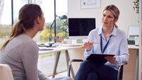 iStock-1399141909.jpg Woman Doctor Or GP In Office Meeting Teenage Female Patient For Appointment